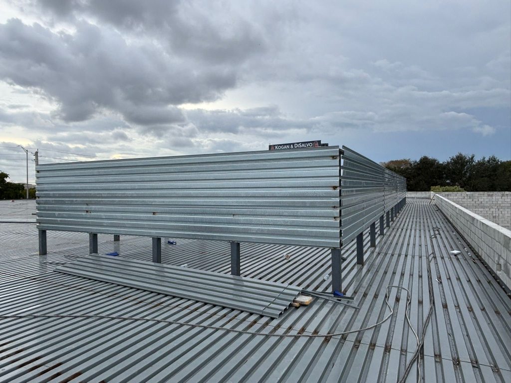 Structural metal roof decking on a commercial build-out by DMG Builders