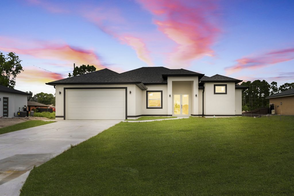 Custom home built by DMG Builders in Lehigh Acres, FL photographed at sunset